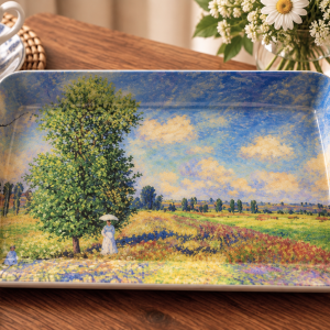 small-tary-springtime - Butterflygifts Ltd Rectangular decorative plate showing a sunny countryside with a large tree, wildflowers, and two figures on a wooden table.