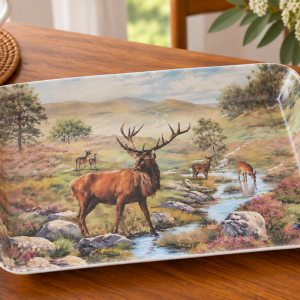 Decorative rectangular plate showing a stag with several deer by a stream in a colorful, hilly landscape by a river valley.